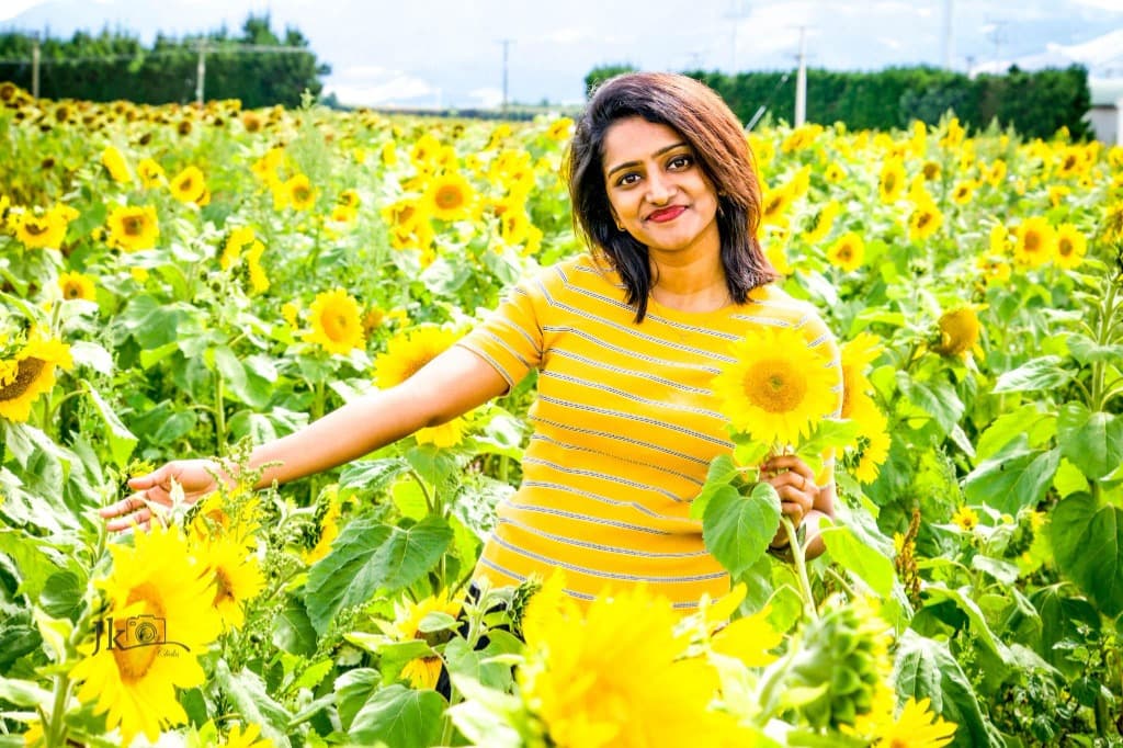Riya Francis in a sunflower field